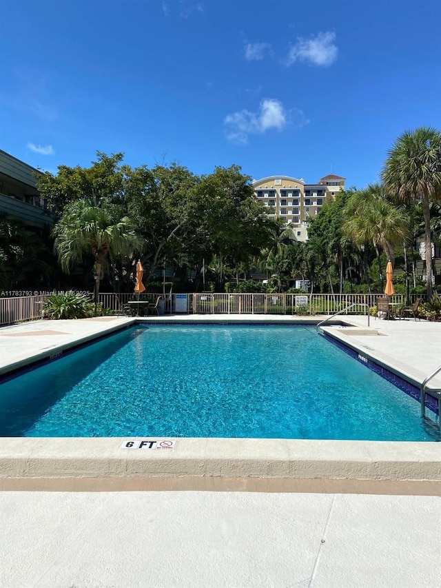 8335 SW 72nd Ave Unit 202D, Miami, FL 33143 - community pool with fence and a patio