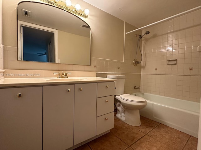 8335 SW 72nd Ave Unit 202D, Miami, FL 33143 - full bathroom with tile patterned flooring, vanity, toilet, shower / washtub combination, and tile walls
