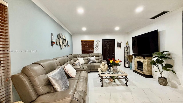 living area featuring marble look tile flooring, recessed lighting, crown molding, and a fireplace