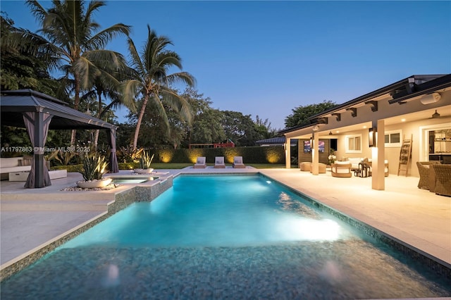10921 SW 102nd Ct, Miami, FL 33176 - view of swimming pool featuring a gazebo, a patio, a fenced backyard, and a pool with connected hot tub