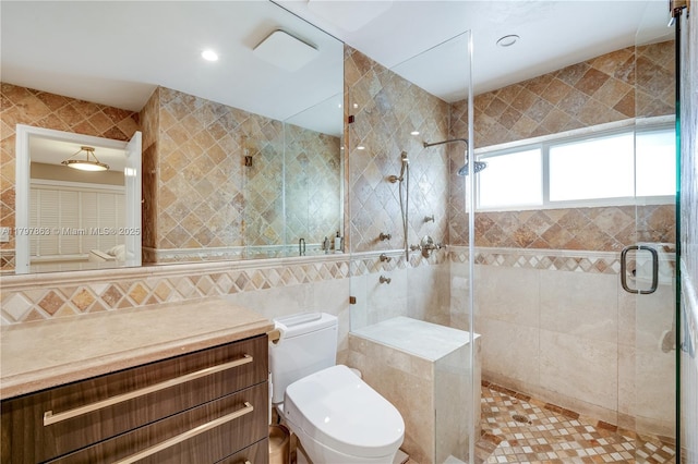 10921 SW 102nd Ct, Miami, FL 33176 - bathroom featuring tile walls, a stall shower, vanity, and toilet