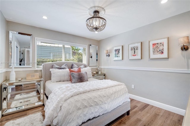 10921 SW 102nd Ct, Miami, FL 33176 - bedroom with a chandelier, wood finished floors, recessed lighting, and baseboards