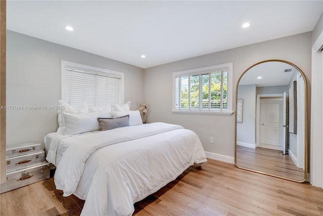 10921 SW 102nd Ct, Miami, FL 33176 - bedroom with light wood finished floors, baseboards, and recessed lighting