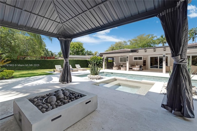10921 SW 102nd Ct, Miami, FL 33176 - view of pool featuring a patio area, an outdoor living space with a fire pit, an in-ground hot tub, and a gazebo