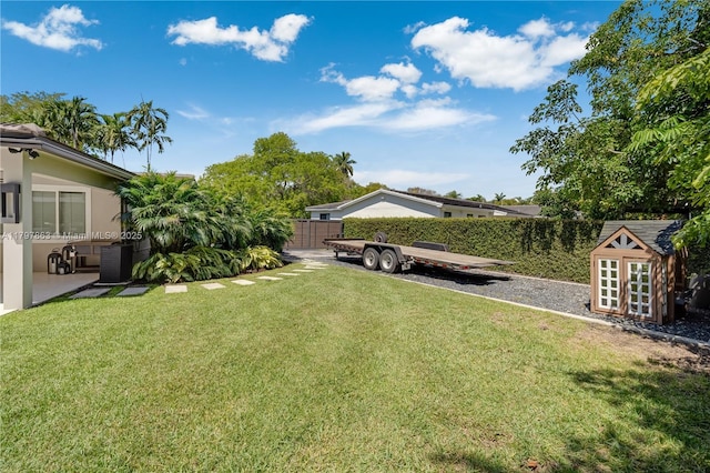 10921 SW 102nd Ct, Miami, FL 33176 - view of yard featuring central air condition unit, a shed, and an outdoor structure