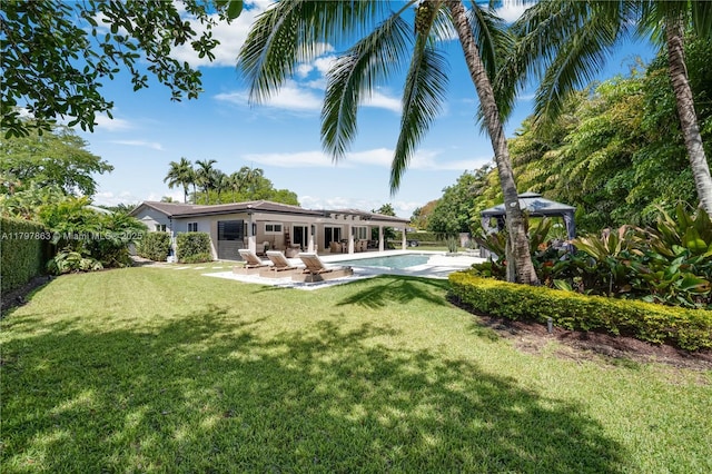 10921 SW 102nd Ct, Miami, FL 33176 - back of property with a gazebo, an outdoor pool, and a patio area