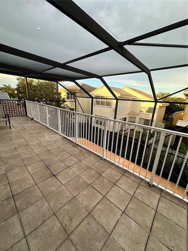 view of patio / terrace featuring a lanai