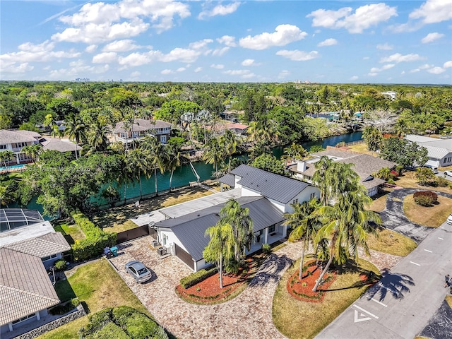 aerial view of residential area featuring a large body of water