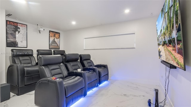 cinema featuring marble finish floors, recessed lighting, and baseboards