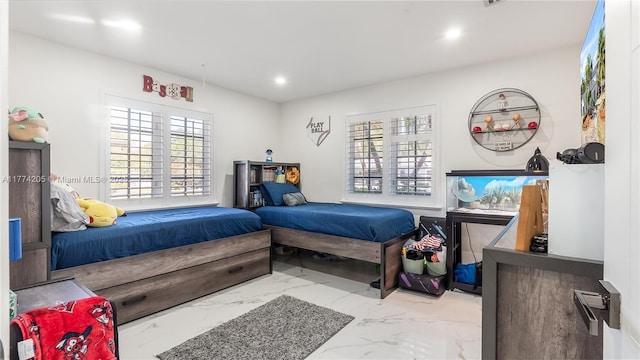 bedroom featuring marble finish floors, multiple windows, and recessed lighting