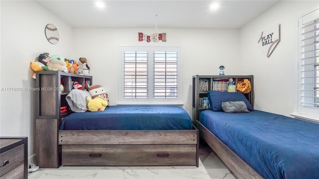 bedroom with marble finish floors