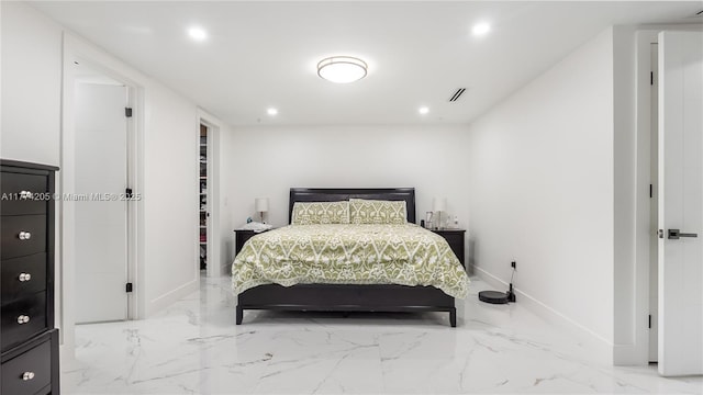 bedroom with marble tiled flooring, recessed lighting, and baseboards