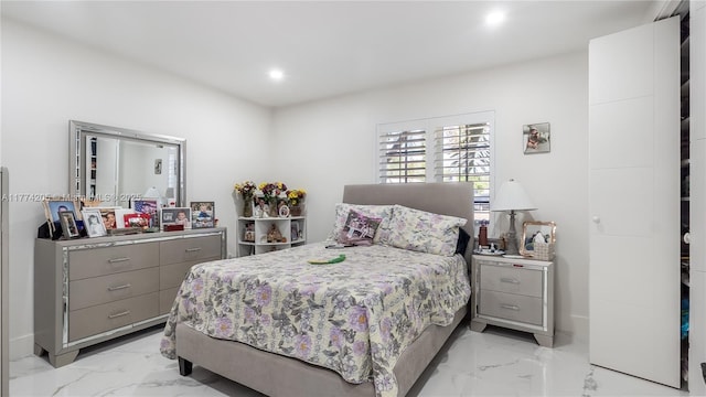 bedroom with light marble finish floors and recessed lighting