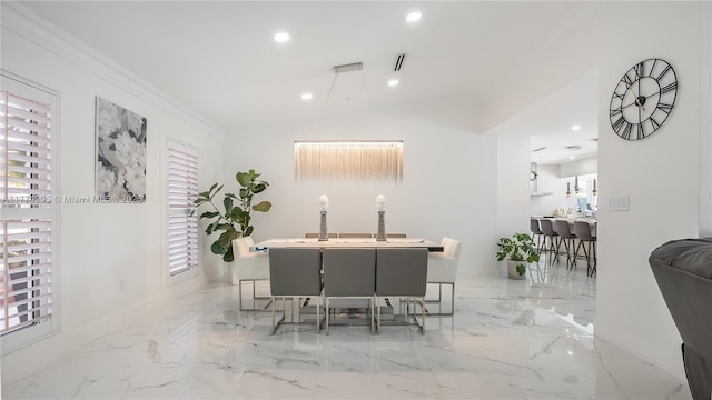 dining space with crown molding, recessed lighting, light marble finish floors, and baseboards