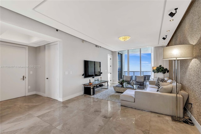 15811 Collins Ave Unit 2506, Sunny Isles Beach, FL 33160 - living area with floor to ceiling windows, marble tiled flooring, and baseboards