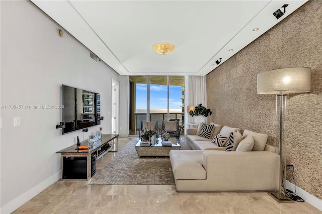 15811 Collins Ave Unit 2506, Sunny Isles Beach, FL 33160 - living room with expansive windows and baseboards