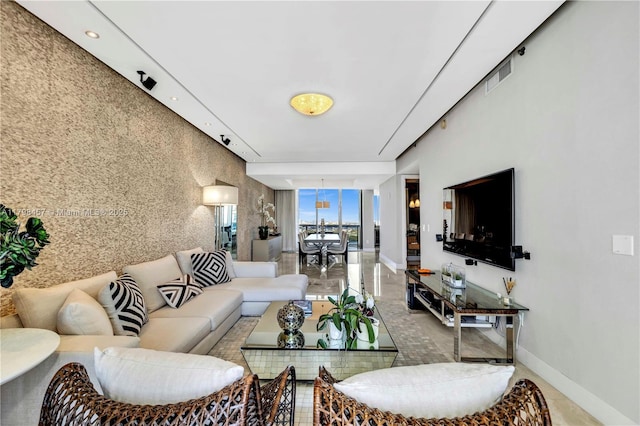 15811 Collins Ave Unit 2506, Sunny Isles Beach, FL 33160 - living area with baseboards and a wall of windows