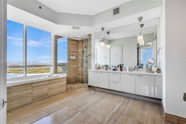 15811 Collins Ave Unit 2506, Sunny Isles Beach, FL 33160 - full bathroom featuring a stall shower, a bath, and vanity