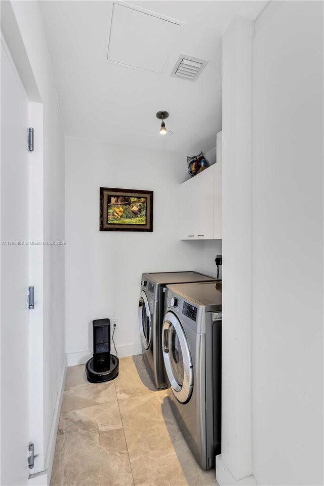 15811 Collins Ave Unit 2506, Sunny Isles Beach, FL 33160 - laundry room featuring cabinet space, separate washer and dryer, and baseboards