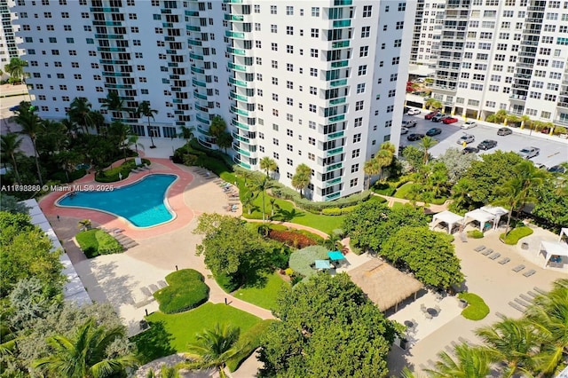 aerial view of a pool and apartment complex / building