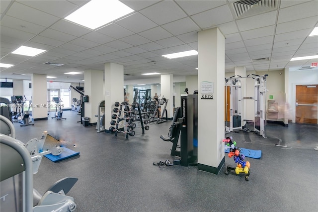 workout area with a paneled ceiling