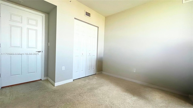 1745 E Hallandale Beach Blvd Unit 2007W, Hallandale Beach, FL 33009 - unfurnished bedroom featuring carpet, baseboards, and a closet