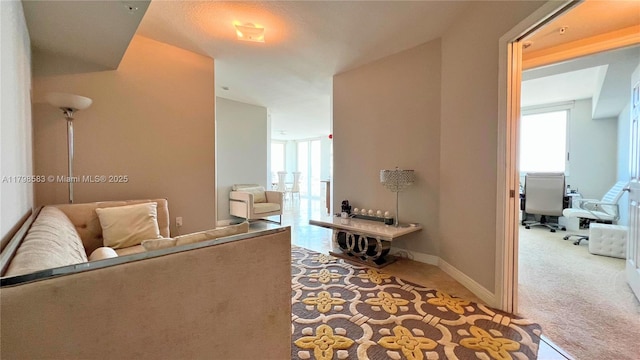 1745 E Hallandale Beach Blvd Unit 2007W, Hallandale Beach, FL 33009 - hall featuring carpet flooring, baseboards, and an office area