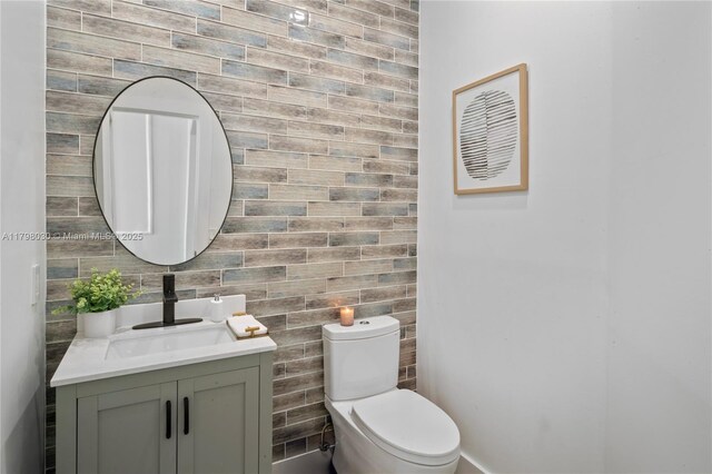 1199 NW 166th Ave, Pembroke Pines, FL 33028 - half bathroom with vanity, tile walls, and toilet