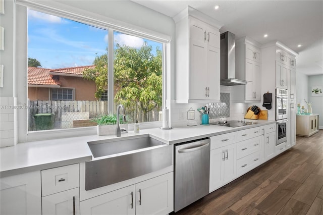 1199 NW 166th Ave, Pembroke Pines, FL 33028 - kitchen with stainless steel appliances, wall chimney range hood, a sink, dark wood finished floors, and tasteful backsplash
