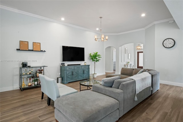 1199 NW 166th Ave, Pembroke Pines, FL 33028 - living area featuring arched walkways, crown molding, wood finished floors, recessed lighting, and baseboards