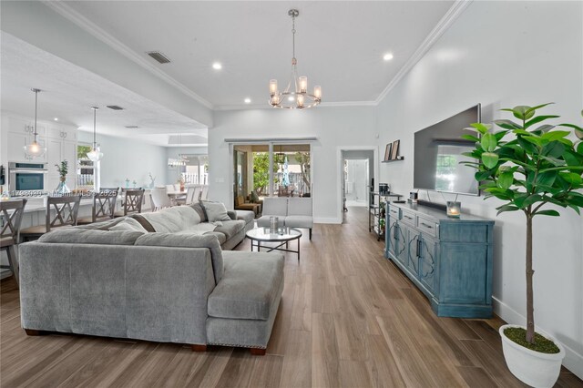 1199 NW 166th Ave, Pembroke Pines, FL 33028 - living room with healthy amount of natural light, recessed lighting, wood finished floors, and ornamental molding