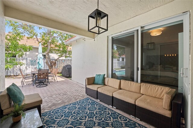 1199 NW 166th Ave, Pembroke Pines, FL 33028 - view of patio with outdoor lounge area and outdoor dining space