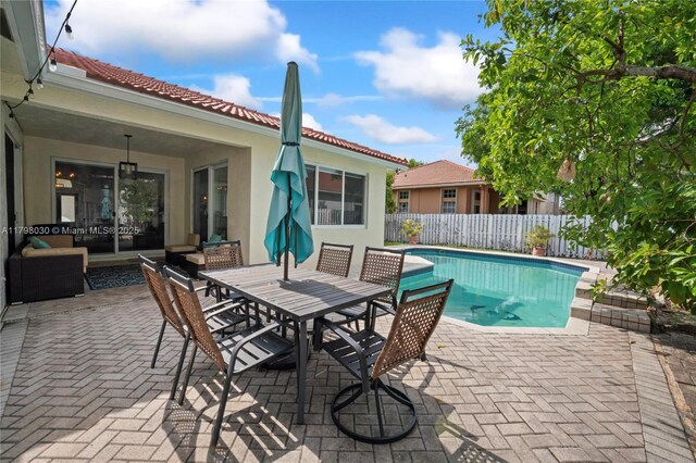 1199 NW 166th Ave, Pembroke Pines, FL 33028 - view of pool featuring a patio and outdoor dining area