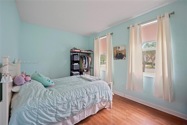 1199 NW 166th Ave, Pembroke Pines, FL 33028 - bedroom with wood finished floors and baseboards