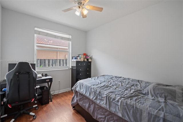1199 NW 166th Ave, Pembroke Pines, FL 33028 - bedroom featuring wood finished floors, a desk, ceiling fan, and baseboards