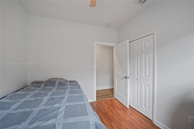 1199 NW 166th Ave, Pembroke Pines, FL 33028 - bedroom featuring wood finished floors, a ceiling fan, a closet, and baseboards