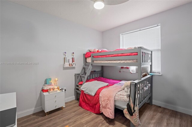 1199 NW 166th Ave, Pembroke Pines, FL 33028 - bedroom with wood finished floors, baseboards, and a ceiling fan
