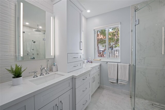 1199 NW 166th Ave, Pembroke Pines, FL 33028 - bathroom with marble look tile flooring, double vanity, a marble finish shower, recessed lighting, and baseboards
