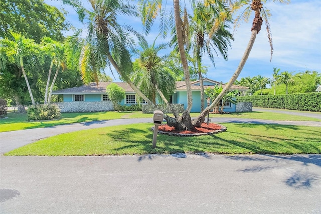 7700 SW 168th Ter, Palmetto Bay, FL 33157 - view of front of property featuring a front yard and asphalt driveway