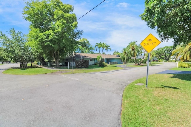 7700 SW 168th Ter, Palmetto Bay, FL 33157 - view of asphalt road featuring traffic signs