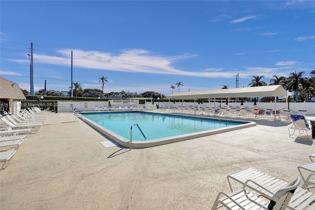 1450 NW 18th Ave Unit 203, Delray Beach, FL 33445 - community pool with a patio and fence