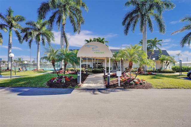 1450 NW 18th Ave Unit 203, Delray Beach, FL 33445 - view of building exterior with fence