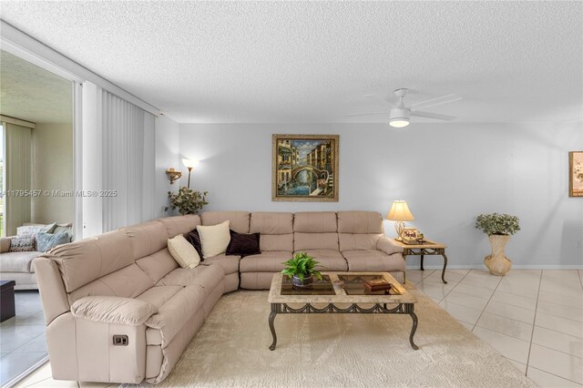 2541 N Nob Hill Rd Unit 205, Sunrise, FL 33322 - tiled living area featuring a textured ceiling, ceiling fan, and baseboards