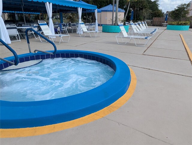 2541 N Nob Hill Rd Unit 205, Sunrise, FL 33322 - view of pool featuring a patio area and a hot tub