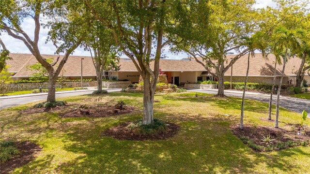 2541 N Nob Hill Rd Unit 205, Sunrise, FL 33322 - ranch-style house featuring a front lawn and stucco siding