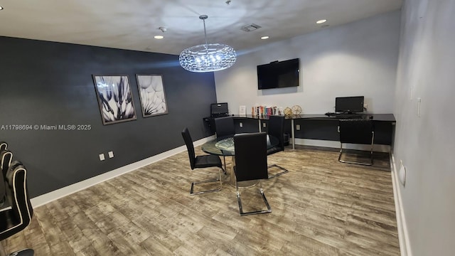 dining room with wood finished floors, recessed lighting, baseboards, a chandelier, and a desk