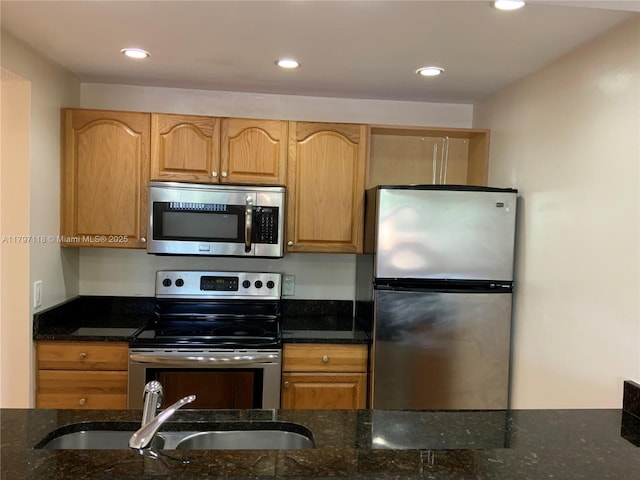 8180 Geneva Ct Unit 224, Doral, FL 33166 - kitchen featuring stainless steel appliances, a sink, dark stone counters, and recessed lighting