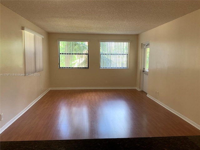 8180 Geneva Ct Unit 224, Doral, FL 33166 - spare room with wood finished floors, a textured ceiling, and baseboards