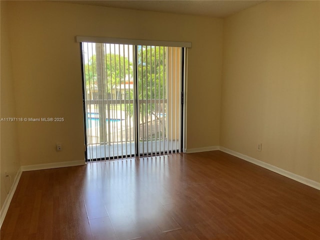 8180 Geneva Ct Unit 224, Doral, FL 33166 - spare room featuring wood finished floors and baseboards