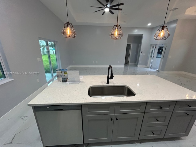 kitchen with stainless steel dishwasher, a sink, open floor plan, gray cabinetry, and recessed lighting
